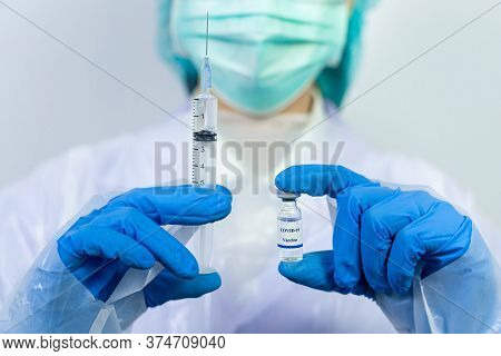 Doctor, Scientist, Researcher Hand In Blue Gloves Or Protective Suit Preparing For Human Clinical In