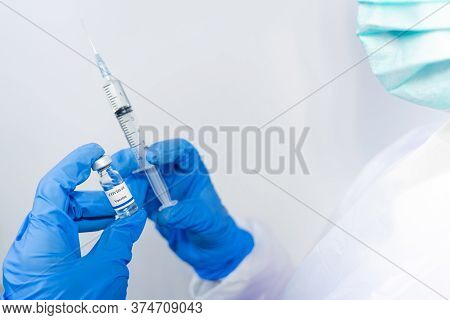 Doctor, Scientist, Researcher Hand In Blue Gloves Or Protective Suit Preparing For Human Clinical In