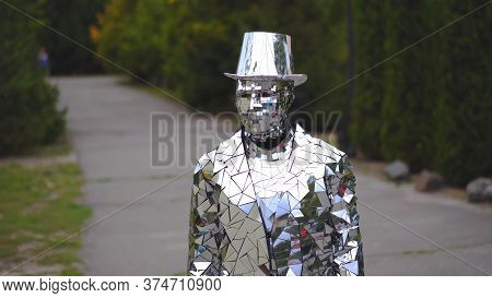 Unusual Man In Mirror Suit And Hat Is Standing In The Street Like Statue Or Monument. Ukraine- Kyiv-