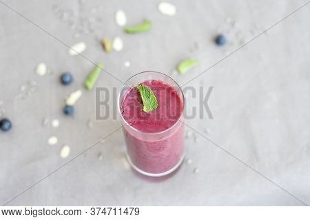 Strawberries And Bananas Smoothie Decorated With A Mint Leaf, Healthy Food Scene