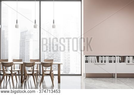 Interior Of Modern Office Cafe With Pink Walls, Cocnrete Floor, Dining Table With Wooden Chairs And 