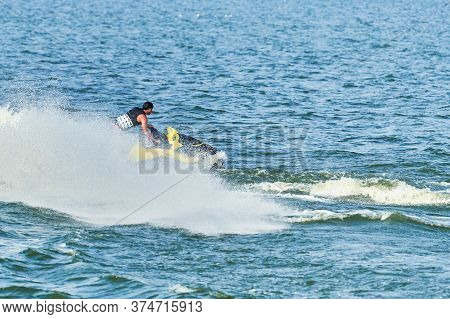 Man On Water Scooter. Summer Vacation On Personal Watercraft In Tropical Sea. Young Guy Sea Riding H