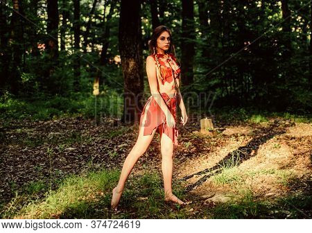 Female Spirit Mythology. Wild Woman In Forest. Sexy Girl Early Stage In The Evolutionary Development