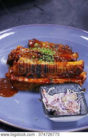 Pork Baby Ribs Glazed With Barbecue Sauce  And Coleslow Salad