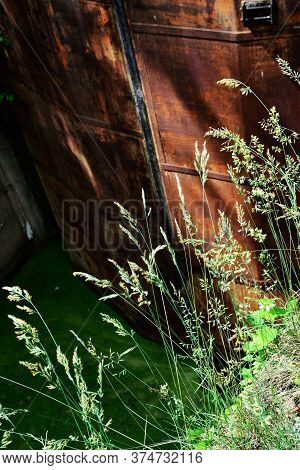 Old rusty floodgate
 gates abandoned anthropogenic landscape