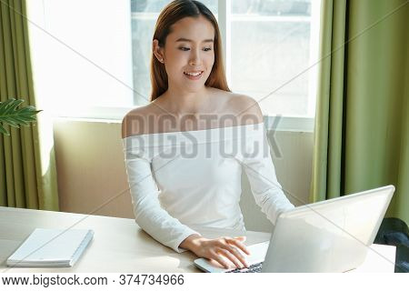 Asian Woman Working From Home Using Internet Communication Concept.
