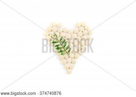 Heart Pills, Tablets, Statins And Drugs Arranged Into The Shape Of A Heart On A White Background Wit