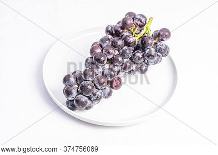 Kyoho Plump Kyoho Grapes (giant Mountain Grapes) Isolated On White In A Dripping Dish, Sweet And Del