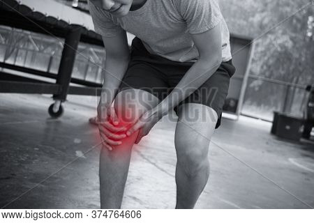 Young Man Get Injured During Jogging. Hands On The Pain Khee.
