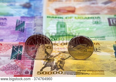 Ugandan Coins - Shilling On The Background Of Money