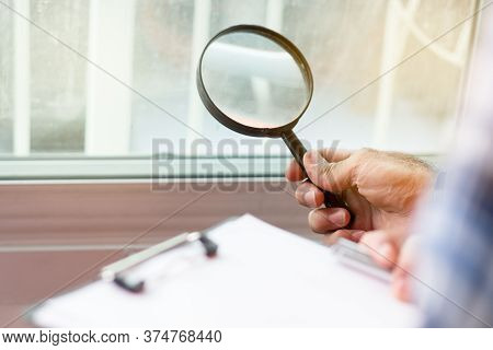Inspection Checklist Review Material Property. Consultant House Inspector Holding Magnifying Glass C