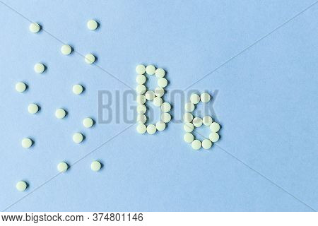 Vitamin B6 Pills Forming The Word B6 Over Turquoise Background, Banner. Free Space. Space For Text. 