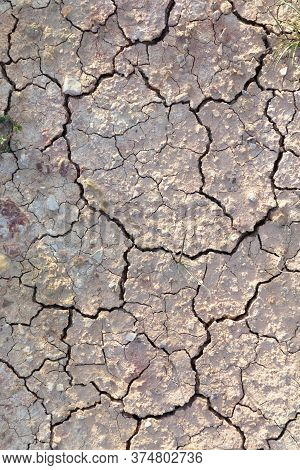Detail Of Cracked Loam As Symbol Of Heat