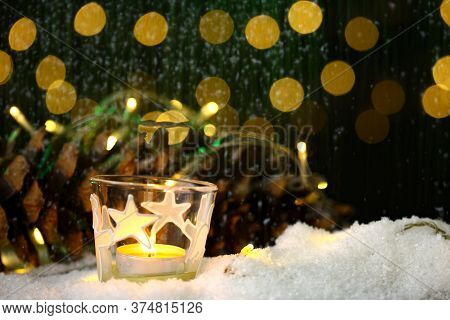 Christmas Theme With Candles, Snow, Pine Cone And Christmas Light