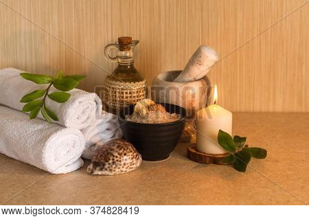 Spa, Beauty And Wellness Background. Towel, Cosmetic Massage Oil, Fresh Leaf, Sea Salt With Shells A