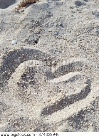 Heart In The Sand. Hand Drawn. A Symbol Of Love.