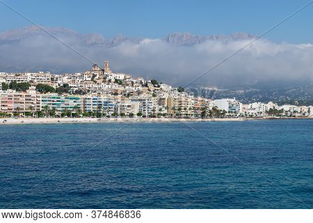 View Over The Ocean On The City Of Altea With Blue Domed Church Along Costa Blanca Coast With Cloudy