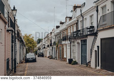 London, Uk - June 20, 2020: Rows Of Townhouses With Garages On Holland Park Mews. Houses In Mews Are
