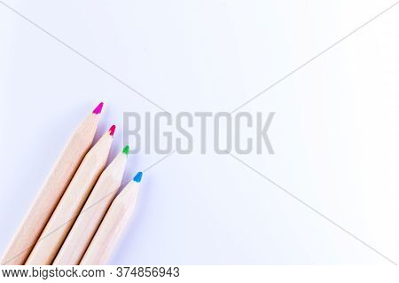 Four Wooden Pencils Colors With White Background