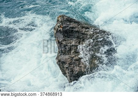 Big Stone In Azure Water Of Mountain River Close-up. Blue Nature Background With Big Boulder In Turq