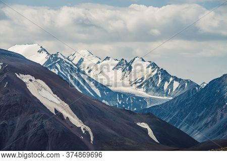 Atmospheric Alpine View To Big Mountain With Snowy High Sharp Tops. Scenic Highland Landscape With G