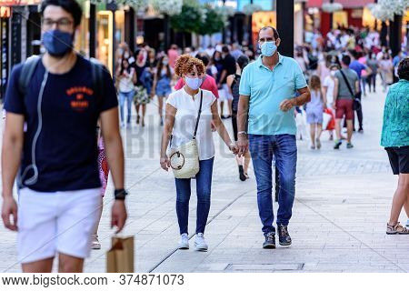 Andorra La Vella, Andorra : 2020 July 06 : People Walk In The Comercial Street Named Meritxell After