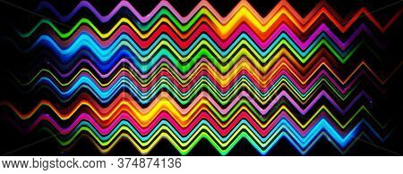 Panomaric Glowing Blurred Light Stripes In Motion Over On Abstract Background. Rainbowl Rays. Led Li
