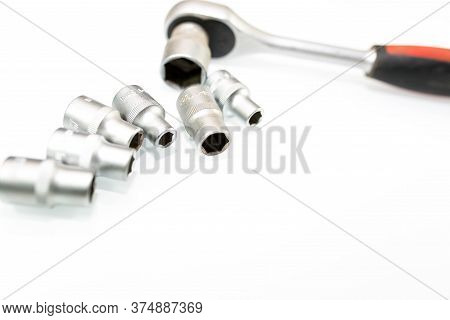 Used Rachet Wrench With Sockets On White Background With Copy Space.