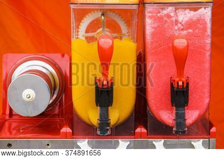 Close Up Of Slush Machine. Slushy Ice Made Colorful Drink Refreshing During Summer