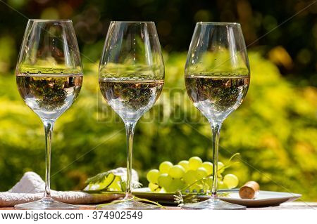 Tasting Of Pinot Gridgio Rose Wine On Winery Terrace In Veneto, Italy. Glasses Of Cold Dry Wine Serv