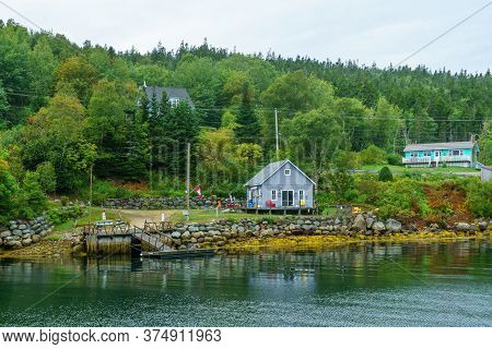 Views Of The Bay, Boats And Waterfront Buildings In The Fishing Village Aspotogan, Nova Scotia, Cana