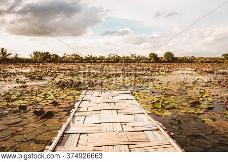 Panorama View Bamboo Bridge Over The Red Lotus Lake Against Blue Sky In Summer Tung Dok Bua Dang .na