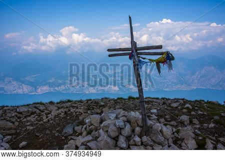 Wooden Cross Marks The Peak Of Cima Delle Pozzette Above Malcesine, Verona, Italy