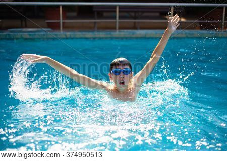 Child Drowning In To The Water And Show Up Hands For Help