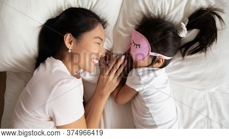 Smiling Caring Asian Ethnic Mommy Watching Little Baby Sleeping.