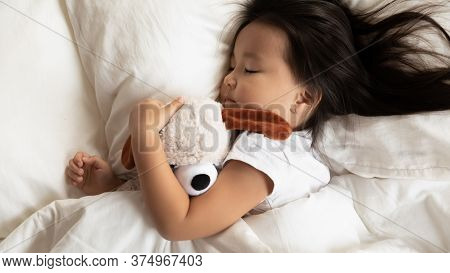 Charming Cute Little Asian Ethnic Girl Baby Sleeping In Bed.