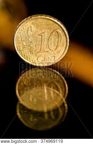 Euro Coins On A Glass Table.