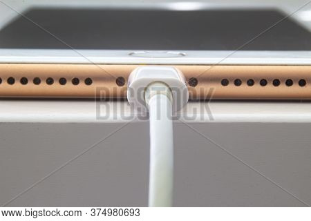 Calgary, Alberta. Canada July 5, 2020. Macro View Of An Iphone Plus Charging With A Lightning Usb Ca