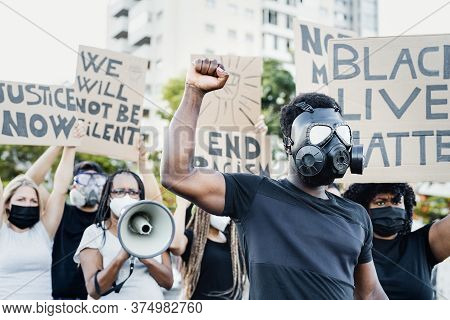 Activist Wearing Gas Mask Protesting Against Racism And Fighting For Equality - Black Lives Matter D