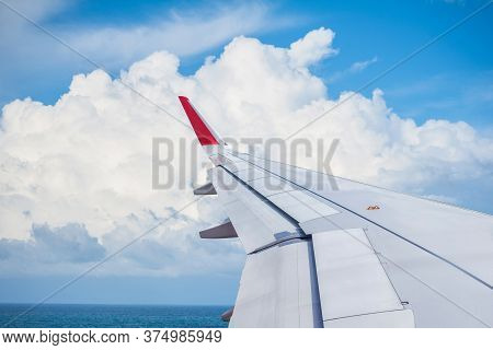 Big Clound And Seascape View From Airplane Window