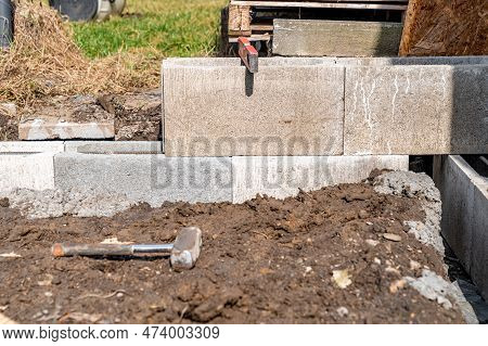 The Foundation Of The House Is Made Of Concrete Blocks Bound With Metal Armature