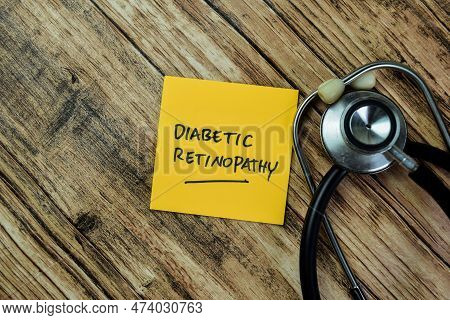 Concept Of Diabetic Retinopathy Write On Sticky Notes With Stethoscope Isolated On Wooden Table.
