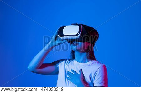 Woman In Vr Headset Looking Up And Trying To Touch Objects In Virtual Reality. Vr Headset. Excited Y