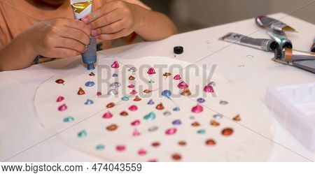 Kid Activity Creative And Idea, Playgroup Concept, Girl Hand Sqeeze Paint Tube Colorful Dot On Paper