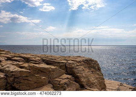 Details Of Structure Of A Limestone Rock Above The Sea. Thracian Sea (mediterranean) With Its Horizo