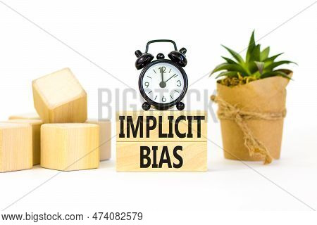 Implicit Bias Symbol. Concept Words Implicit Bias On Wooden Block. Beautiful White Table White Backg