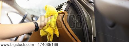 Close-up Of Male Hand Cleaning Vehicle Interior, Cleaner Washes Car Leather Salon. Cleaning Service,