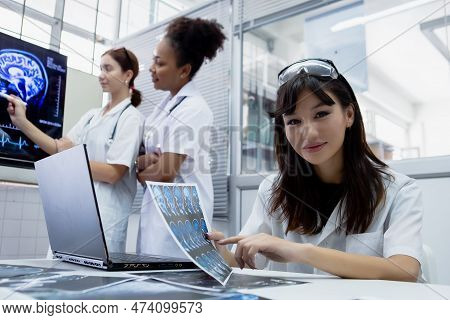 Female Medical Student Study In Class Room. Medical Students Studying Human Brain Disease Diagnosis 