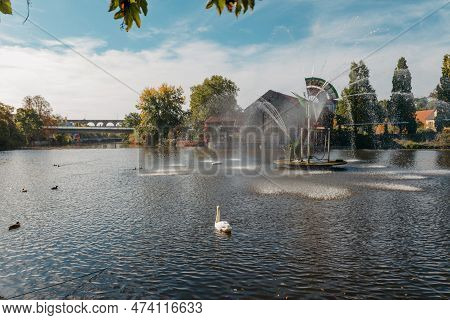City Fountain And Pond With Swan And Ducks In Old European City Bietigheim-bissingen In Germany. The