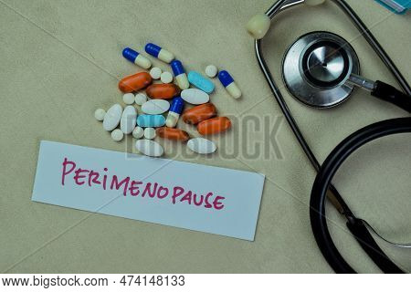 Concept Of Perimenopause Write On Sticky Notes With Stethoscope Isolated On Wooden Table.
